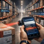 Warehouse staff performing physical stock verification while comparing inventory with ERP records using barcode scanners and a tablet.